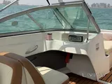 Bayliner 5.3 m boat with trailer, paid parking, and major recent service